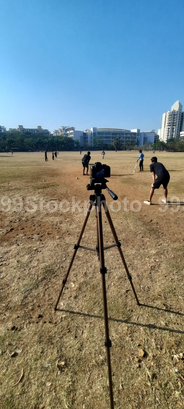Camera on a Tripod recording game of cricket
